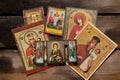 Ukraine Dnepr 18.04.2022 - Icons of the Mother of God and Jesus Christ and Aegela the guardian lie on an old wooden table as Royalty Free Stock Photo