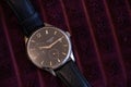 Ukraine Dnepr 10.04.2021 - old men`s Tissot watches lie on a purple fabric close up in daylight Royalty Free Stock Photo