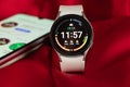 Ukraine Dnepr 11.12.2021 - Smart watch Samsung Galaxy Watch 4 track with a gray strap on an isolated background and an application