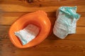 Ukraine Dnipro 20.12.2020 - baby diapers in a baby potty on the floor close-up Royalty Free Stock Photo