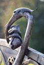Ukraine Dnipro 10.07.2020 - forged sculpture of a stork with a child on a city bench in a park in the summer