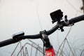Ukraine Dnipro 30.03.2021 - GoPro HERO 9 on the handlebars of a bicycle on a bike ride in the park Royalty Free Stock Photo