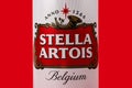 Ukraine. Dnipro. 20 march 2023: Can of Stella Artois beer on beer barrel with red background