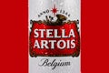 Ukraine. Dnipro. 20 march 2023: Stella Artois beer can with condensation water droplets on red background