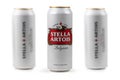 Ukraine. Dnipro. 20 march 2023: Three white can of great Belgium beer Stella Artois on white background
