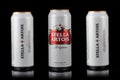 Ukraine. Dnipro. 20 march 2023: Three white can of great Belgium beer Stella Artois on black background