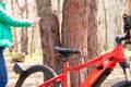 Ukraine Dnipro 05.04.2021 - a red electric bike is recharged in a forest in a park, new technologies