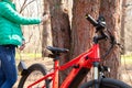 Ukraine Dnipro 05.04.2021 - a red electric bike is recharged in a forest in a park, new technologies