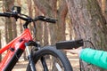 Ukraine Dnipro 05.04.2021 - a red electric bike is recharged in a forest in a park, new technologies