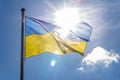 Ukraine flag with bright sunburst shining through