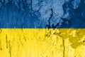 Ukraine Flag colors on an old splashes painted wall. Abstract grunge background