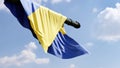 Ukraine flag hanging from a tank turret pointed at the sky, 3d render
