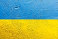 Ukraine flag painted on old concrete wall
