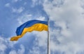 Ukraine flag. Ukrainian blue and yellow flag. Background of blue sky and white clouds. The national flag of Ukraine. Royalty Free Stock Photo