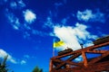 Ukraine flag waving on the wind against the blue sky Royalty Free Stock Photo