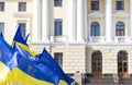 Ukraine independence day concept poster wallpaper picture of yellow blue flags evolving on a wind national government building