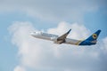 Ukraine international airlines passenger plane in blue sky