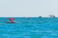 Ukraine, Iron Port - August 25, 2020: Two adult women vacationing tourists ride a water bike catamaran on the blue sea