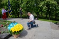 Ukraine, Kanev -May 23, 2021: The man knelt in front of the monument