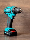 Ukraine, Khmelnitsky, April 2022. Makita cordless screwdriver on a wooden background