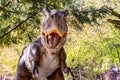 Ukraine, Khmelnitsky, October 2021. Dinosaur model in the park. Giant tyrannosaurus at an exhibition in the park on a summer sunny