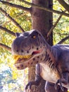 Ukraine, Khmelnitsky, October 2021. Dinosaur model in the park. Giant tyrannosaurus at an exhibition in the park on a summer sunny