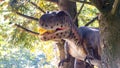 Ukraine, Khmelnitsky, October 2021. Dinosaur model in the park. Giant tyrannosaurus at an exhibition in the park on a summer sunny