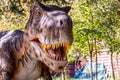 Ukraine, Khmelnitsky, October 2021. Dinosaur model in the park. Giant tyrannosaurus at an exhibition in the park on a summer sunny