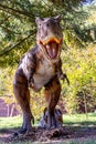 Ukraine, Khmelnitsky, October 2021. Dinosaur model in the park. Giant tyrannosaurus at an exhibition in the park on a summer sunny Royalty Free Stock Photo