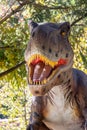 Ukraine, Khmelnitsky, October 2021. Dinosaur model in the park. Giant tyrannosaurus at an exhibition in the park on a summer sunny