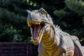 Ukraine, Khmelnitsky, October 2021. Dinosaur model in the park. The head of a albertosaurus with sharp teeth Royalty Free Stock Photo