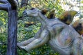 Ukraine, Khmelnitsky, October 2021. A model of a dinosaur, stegosaurus standing on its hind legs near a tree