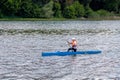 Ukraine, Khmelnytsky. July 2020. The girl swims in a canoe