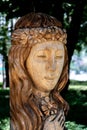 Ukraine, Khmelnytsky. July 2020. Wooden sculpture of a woman of Slavic appearance in a city park