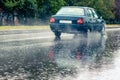 Ukraine, Khmelnytsky, September 2021. The car is driving on the road during heavy rain. Summer rain on the track Royalty Free Stock Photo