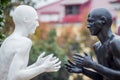 Ukraine. Khmelnytskyi. October 2018. Sculptures by Viktor Sidorenko. The dialogue of representatives of two races. Understanding