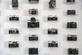 Ukraine, Kiev, 5 August 2020. Collection of vintage cameras and camera lens well organized, top view. Group old cameras. On white