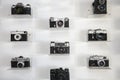 Ukraine, Kiev, 5 August 2020. Collection of vintage cameras and camera lens well organized, top view. Group old cameras. On white