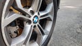 Ukraine, Kiev - August 28,2019 Original BMW alloy wheel dirty and scratched with tires on a car close-up