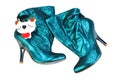 Ukraine, Kiev - August 30, 2011: Women`s boots of shiny skin turquoise. Ankle boots, shoe fashionable products, isolated on white