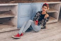 Ukraine. Kiev - 11,25,2019 A cute girl with freckles, dressed in a red bandana and a checkered shirt, drinks Coca-Cola through a