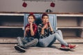 Ukraine. Kiev - 11,25,2019 drink Coca-Cola through a straw, smiling at each other, sitting at home in the kitchen. Advertising,