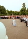 Ukraine Kiev May 2019. Graduates. Beautiful children dance in the open school yard, at the last bell festival for parents