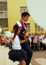 Ukraine Kiev May 2019. Last call. Graduate and first-grader carry a big bell. Leading graduation line. Beautiful school with balls