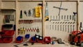 Ukraine, Kiev - May 09, 2020: Work tools on the board and in the workshop. Workshop scene. A lot of old tools on a dirty desktop.