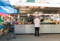 Ukraine, Kiev - October 1, 2019: Farmers food market with a variety of organic vegetables. The seller serves and communicates with