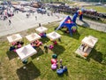 Ukraine, Kiev - SEP 26, 2016: Top view of Red Bull tent in park. View from the drone of the people at the festival near