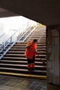 Ukraine, Kiev - September 12, 2019: A cleaning lady is sweeping a staircase in a subway underpass Royalty Free Stock Photo