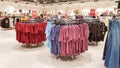 Ukraine, Kiev - September 04, 2019: A large clothing store, mannequins and many rows with hangers, a variety of sizes and colors.