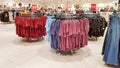 Ukraine, Kiev - September 04, 2019: A large clothing store, mannequins and many rows with hangers, a variety of sizes and colors.